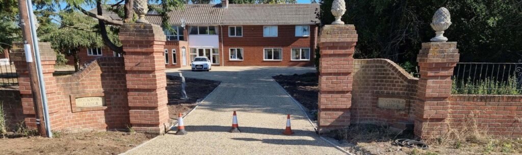 This is a photo of a newly installed chip and tar driveway, installed by Folkestone Driveways