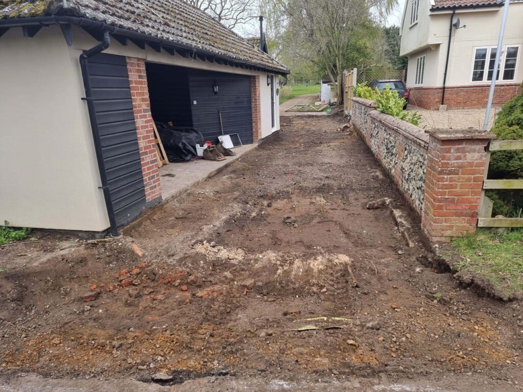 This is a photo of a newly installed chip and tar driveway, installed by Folkestone Driveways